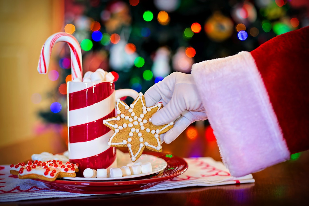 santa reaches for cookie